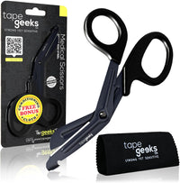 TapeGeeks industrial-grade kinesiology tape scissors shown with product packaging and included cleaning cloth, featuring angled handles and durable stainless steel blades.