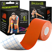 Orange TapeGeeks premium kinesiology tape roll next to branded packaging, used for muscle relief, performance support, and faster recovery.