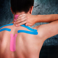 Man with kinesiology tape applied across the upper back and neck to relieve tension, improve posture, and support muscle recovery.