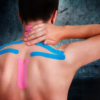 Man with kinesiology tape applied across the upper back and neck to relieve tension, improve posture, and support muscle recovery.