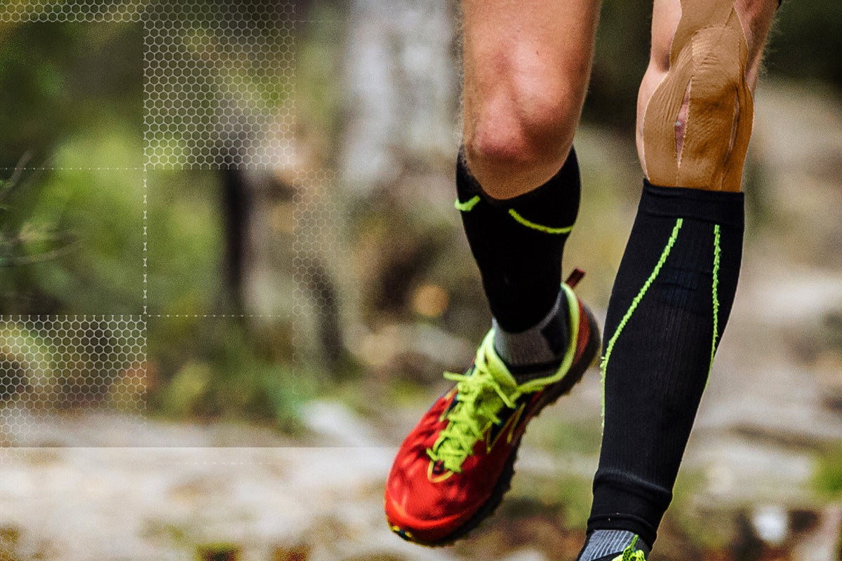 Trail runner wearing beige hypoallergenic kinesiology tape firmly applied to the knee - skin-tone tape designed for sensitive skin