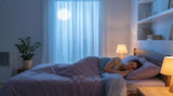 Woman sleeping peacefully at night in a softly lit bedroom, illustrating restful sleep and better breathing for a Canadian mouth tape guide.