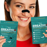Smiling woman demonstrating Tape Geeks BREATHE+ Performance Nasal Strips in black, holding two product packages designed for better breathing and athletic performance.