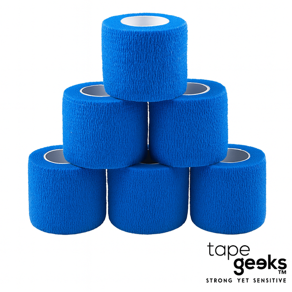 Blue 2-inch TapeGeeks cohesive bandage wraps stacked together, highlighting the flexible, self-adhering design for sports taping, joint stability, and muscle support.