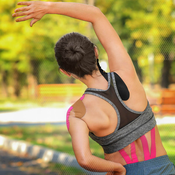 Black and beige TapeGeeks kinesiology tape applied to back and shoulder for muscle relief and support