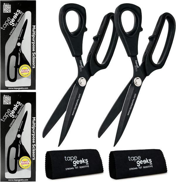 A pair of black TapeGeeks kinesiology tape scissors shown with premium packaging and microfiber cleaning cloths, highlighting their Japanese stainless steel blades and multipurpose cutting performance.