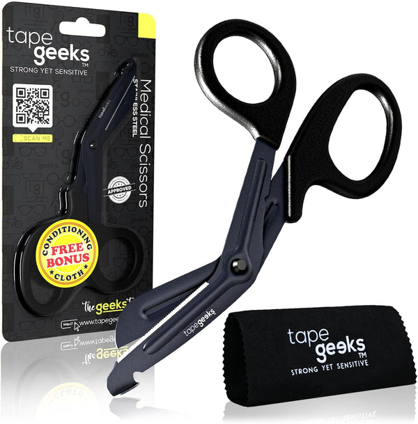 TapeGeeks industrial-grade kinesiology tape scissors shown with product packaging and included cleaning cloth, featuring angled handles and durable stainless steel blades.