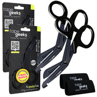 Two TapeGeeks medical scissors with black resin handles and serrated stainless steel blades shown next to branded microfiber cloths and packaging.