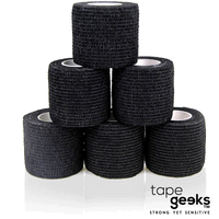 Black TapeGeeks cohesive bandage rolls arranged in a pyramid, showing the breathable, skin-friendly wrap for secure compression and athletic injury protection.