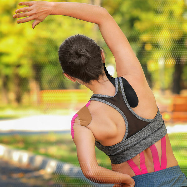Black and beige TapeGeeks kinesiology tape applied to back and shoulder for muscle relief and support