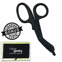 TapeGeeks medical scissors shown with a bonus cleaning cloth, featuring blunted tips and sturdy blades for cutting kinesiology tape, bandages, and fabric with safety and precision.